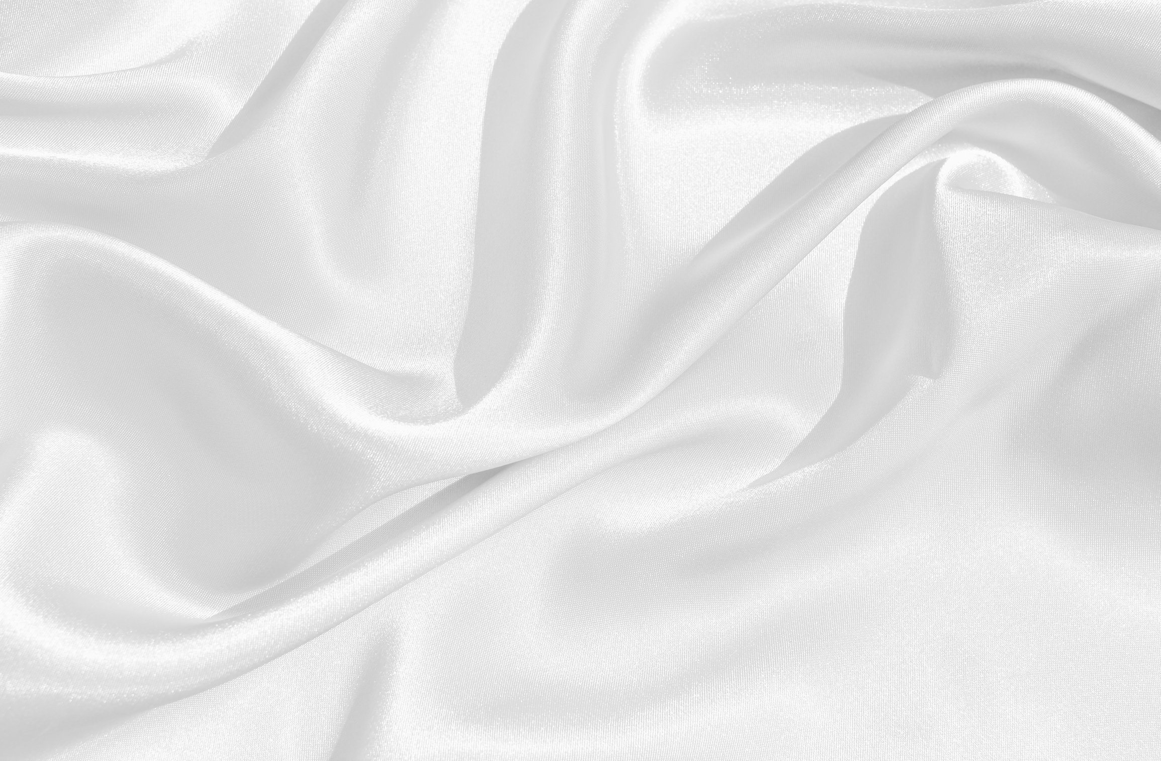 The texture of the satin fabric of white color for the background